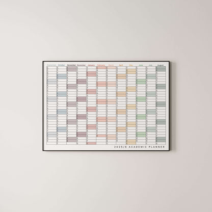 Framed academic wall planner with colourful grid on a light gray wall