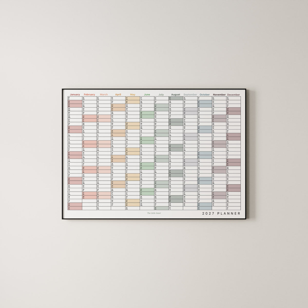 A framed 2027 annual wall planner in landscape with colour coding.