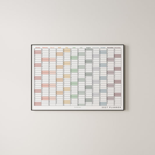 A framed 2027 annual wall planner in landscape with colour coding.