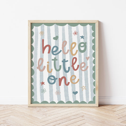 Framed nursery artwork with 'hello little one' text on a striped background for boys bedroom.