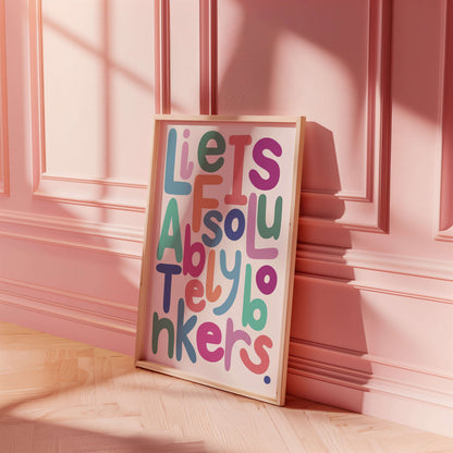 Colourful framed artwork with funny typography on a pink wall