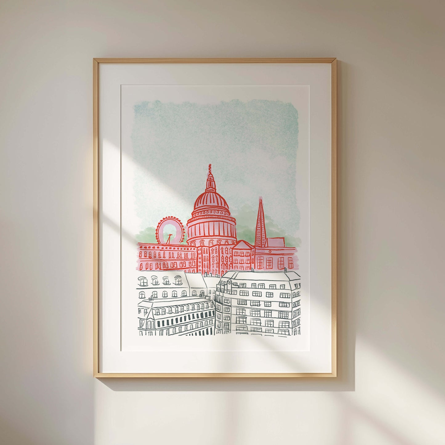 Framed artwork of a cityscape with a prominent building on a light background