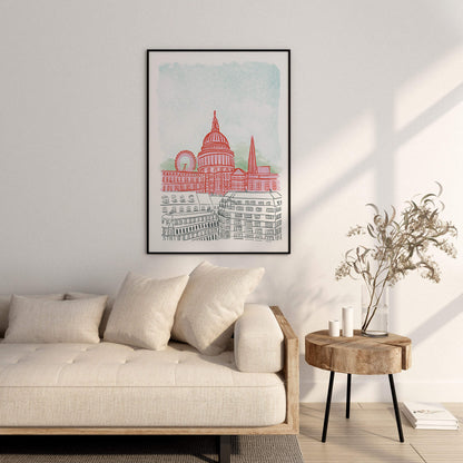 Framed artwork of an illustration of London on a wall above a sofa in a living room.