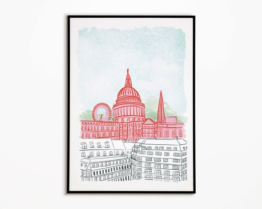 Framed artwork of London cityscape with St Paul's Cathedral on a light blue background.