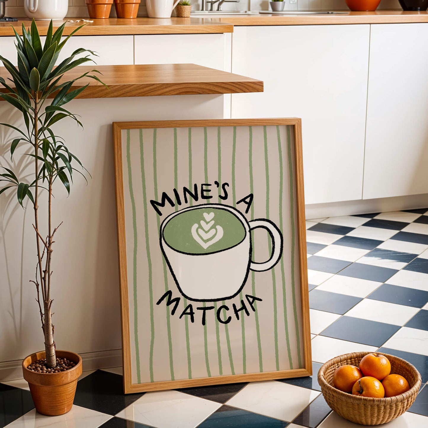 Framed print with a matcha green tea cup design in a kitchen setting.