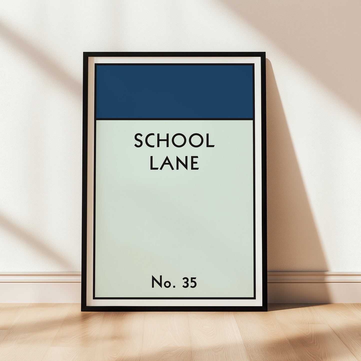 Monopoly style personalised wall art with 'SCHOOL LANE No. 35' text on a blue and green gradient background