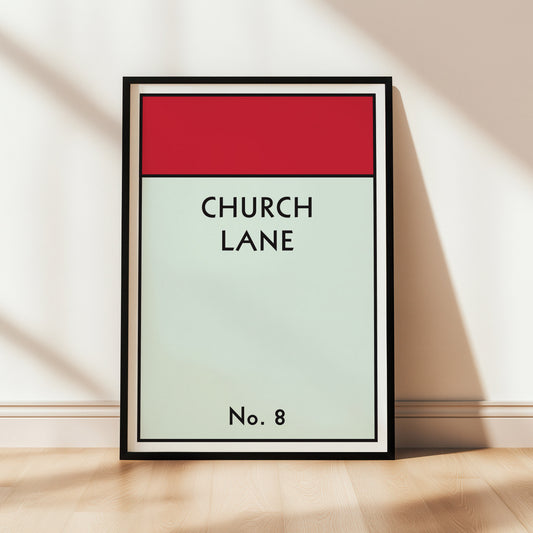 Monopoly style framed artwork with 'Church Lane' text on a red and light green gradient background