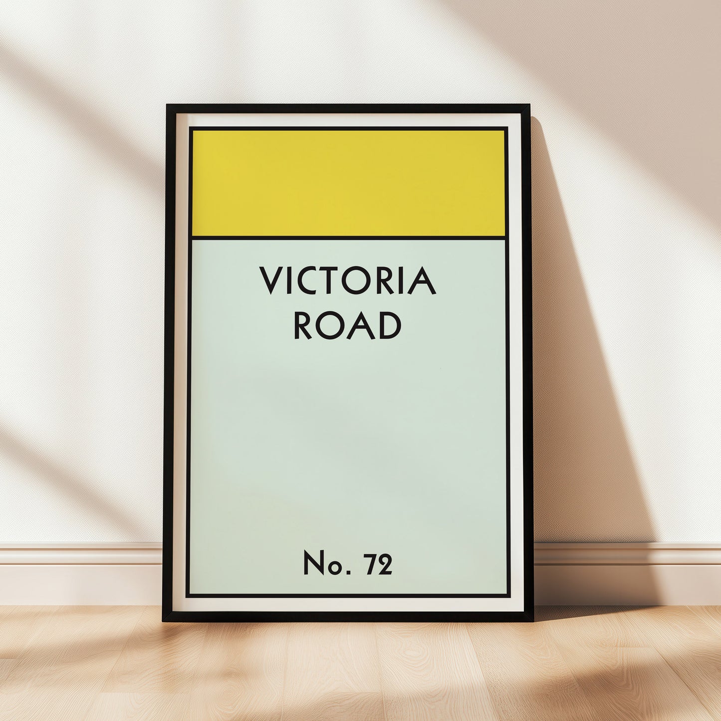 Framed artwork with 'Victoria Road' text on a light background