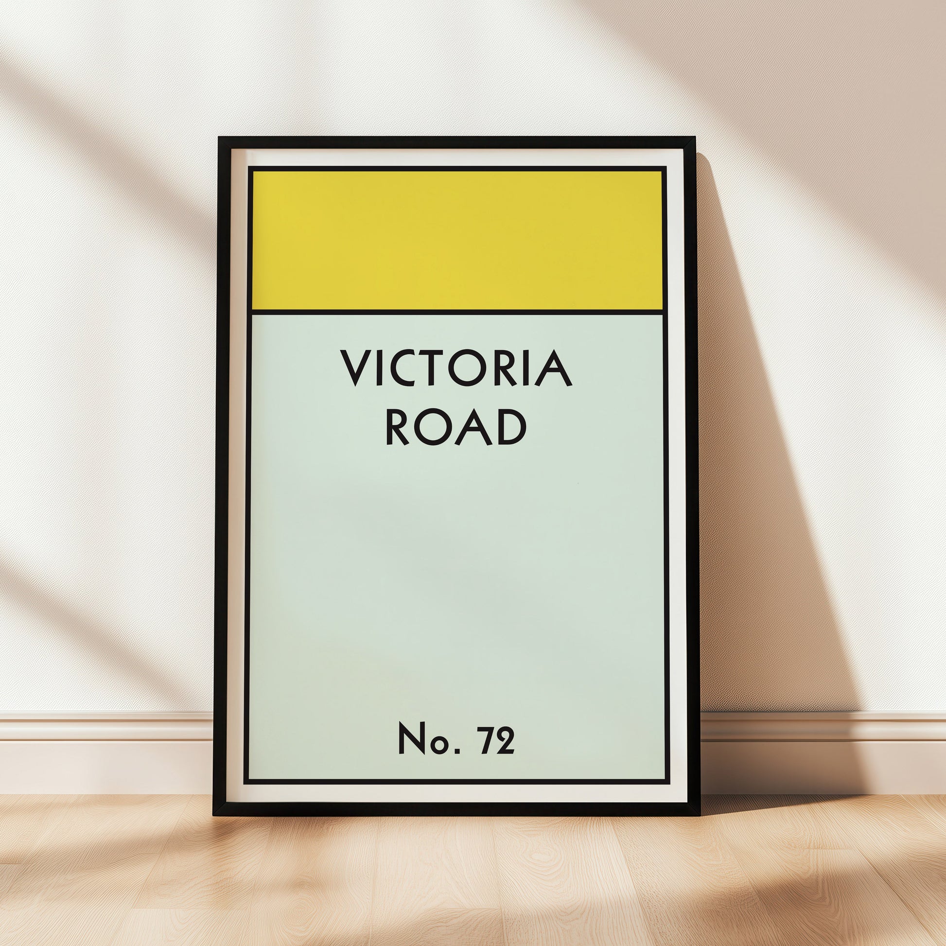 Framed artwork with 'Victoria Road' text on a light background