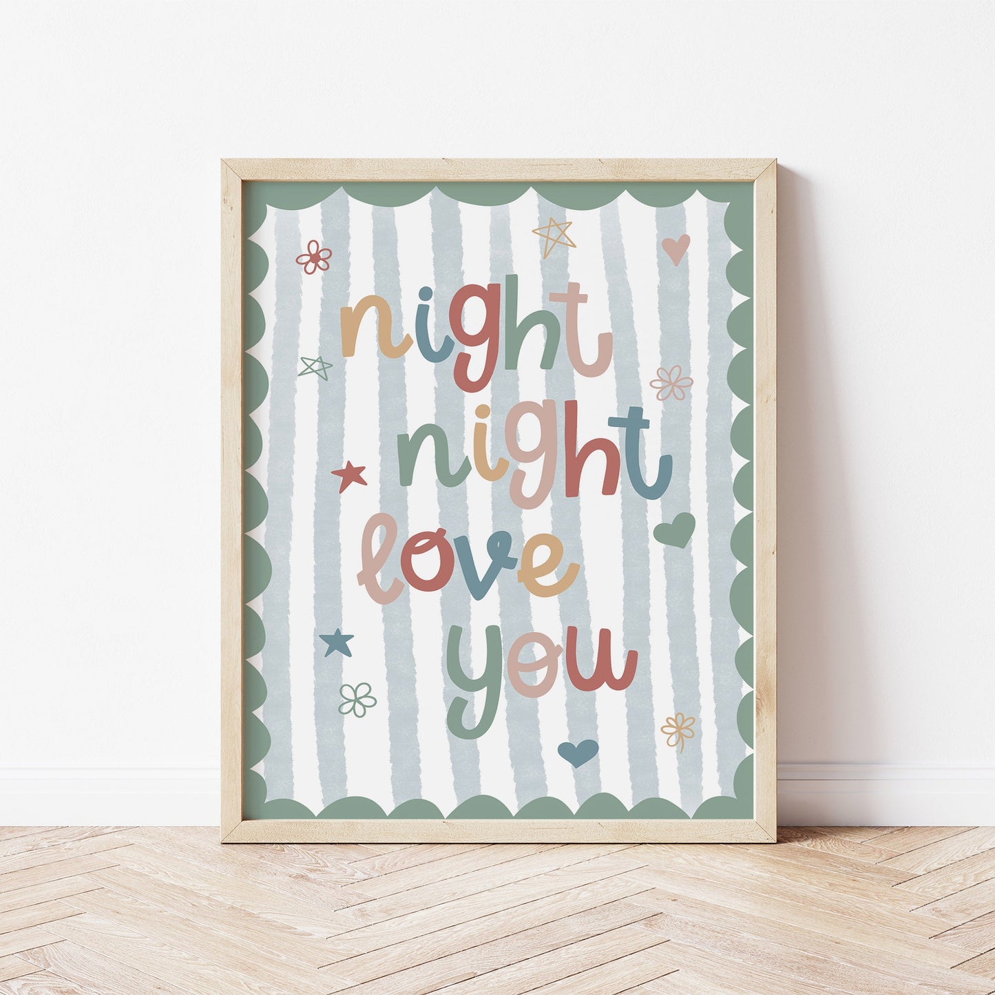 Wood framed artwork with 'night night love you' text on a blue striped background with a green scalloped edge.