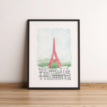 Framed artwork of the Eiffel Tower on a white wall.