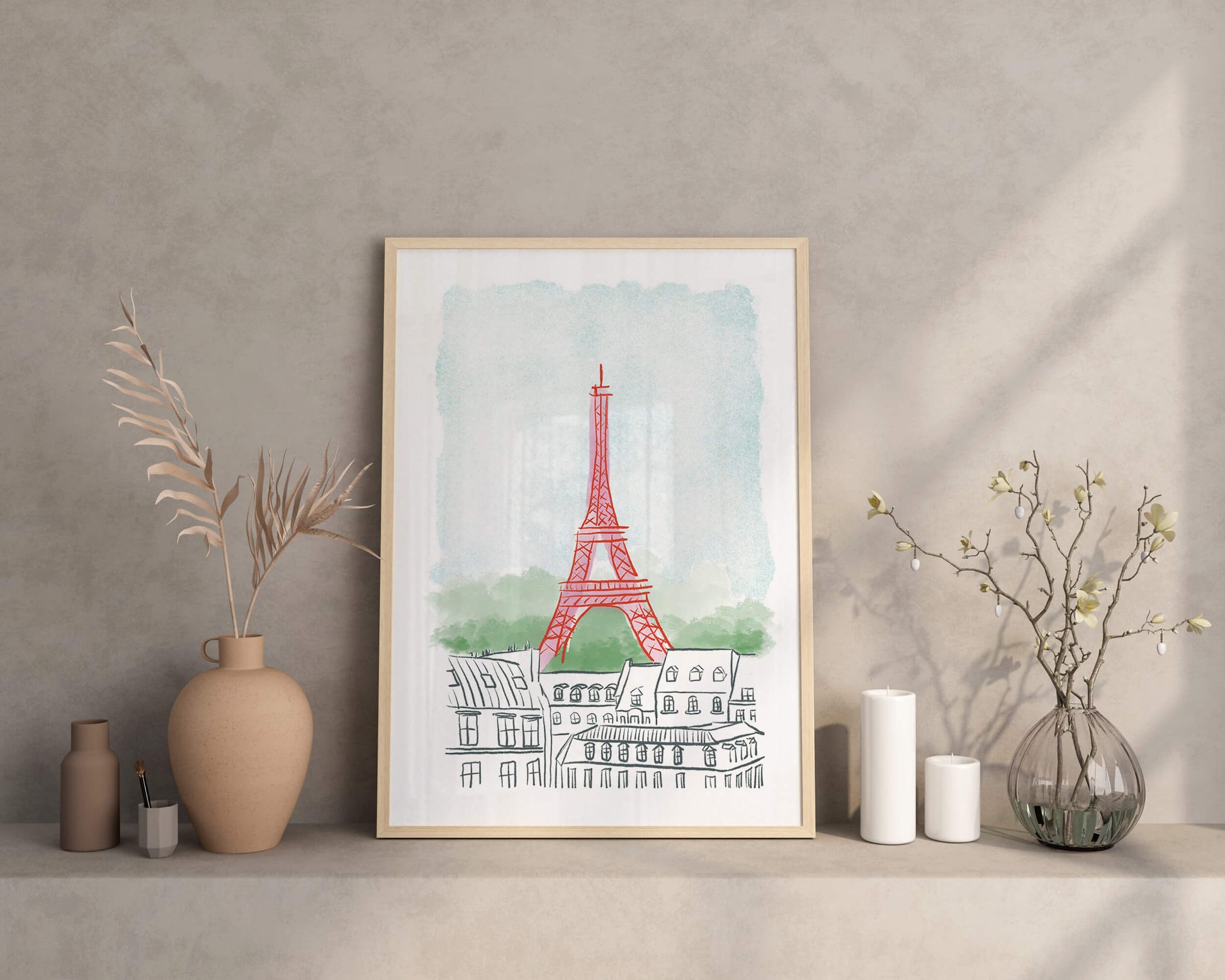 Framed artwork of the Eiffel Tower on a shelf with decorative items.