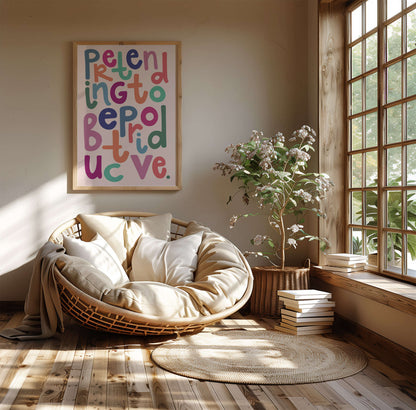 Pretending to be productive bright typography print in a cosy lounge setting.