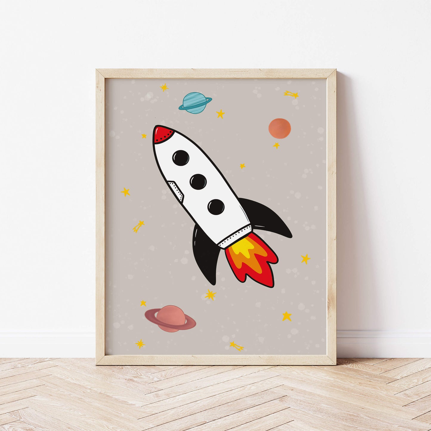 Framed artwork of a rocket ship on a beige background with planets.