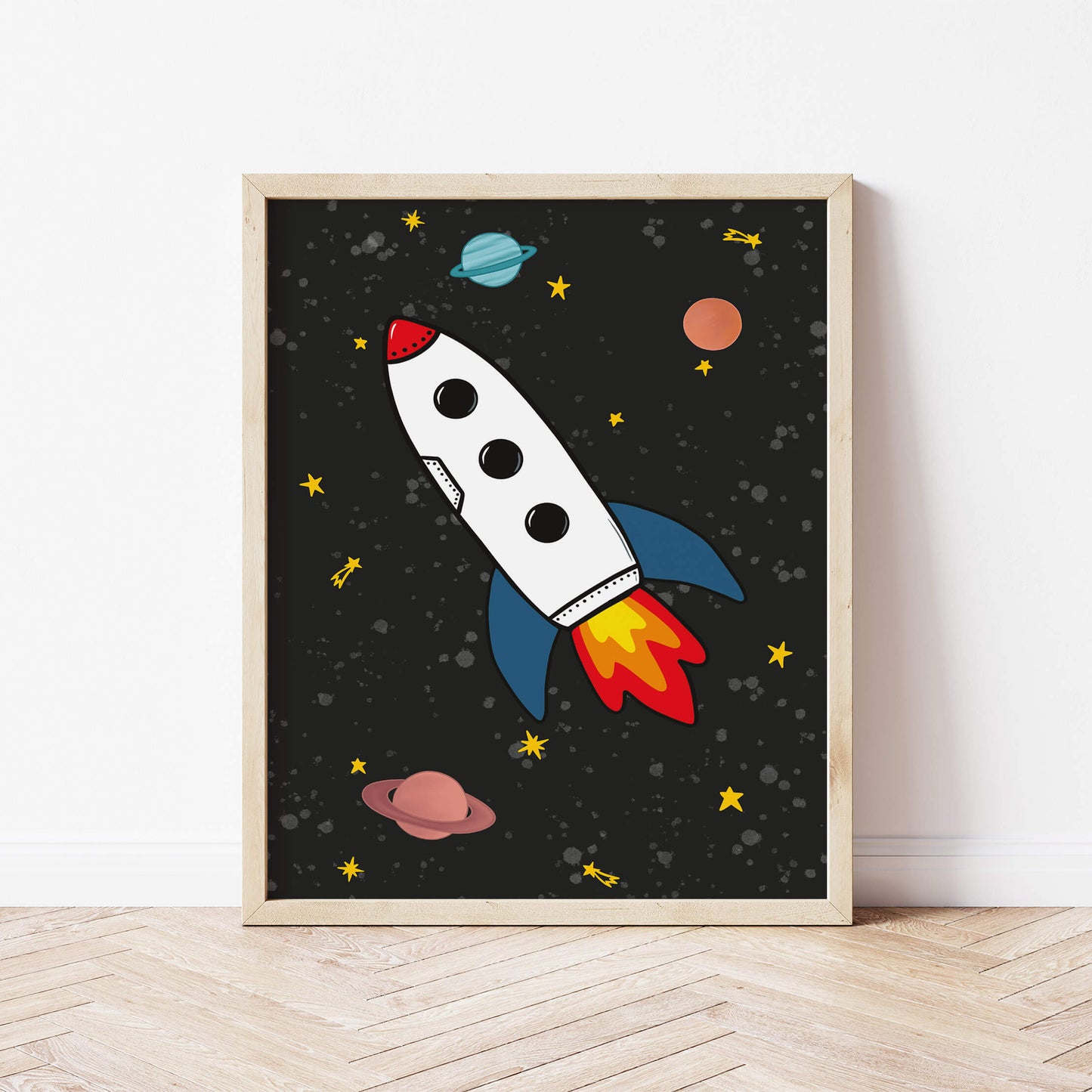 Framed artwork of a rocket ship and planets on a black background