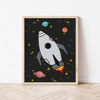 Framed artwork of a rocket ship in space with planets and stars on a black background.