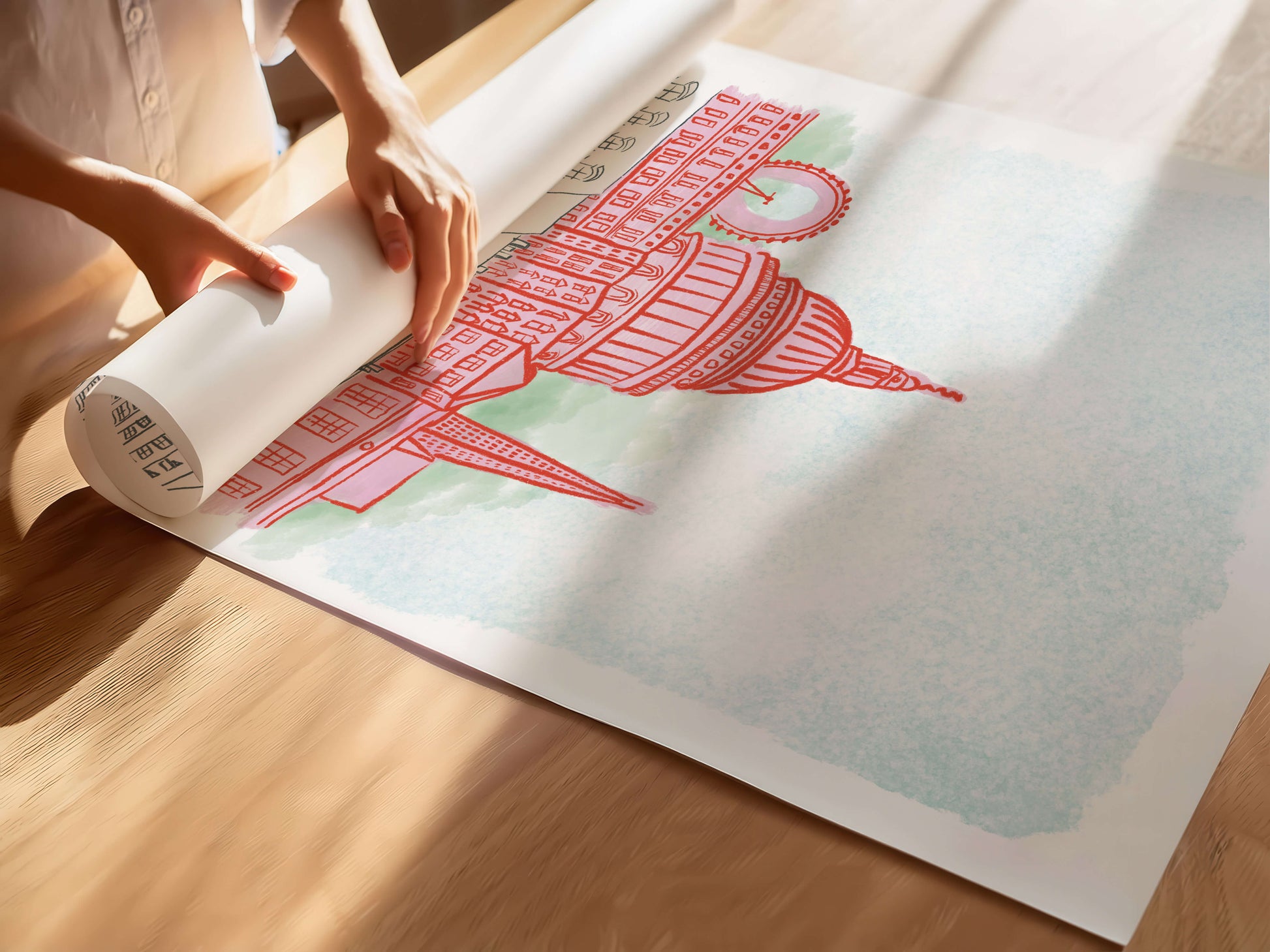 Person unrolling a large poster with a London skyline