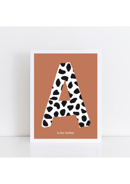 Dalmatian Spot Initial Print - rust background