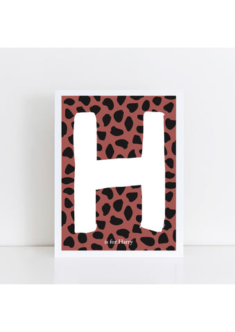 Dalmatian Spot Initial Print - brick/black background